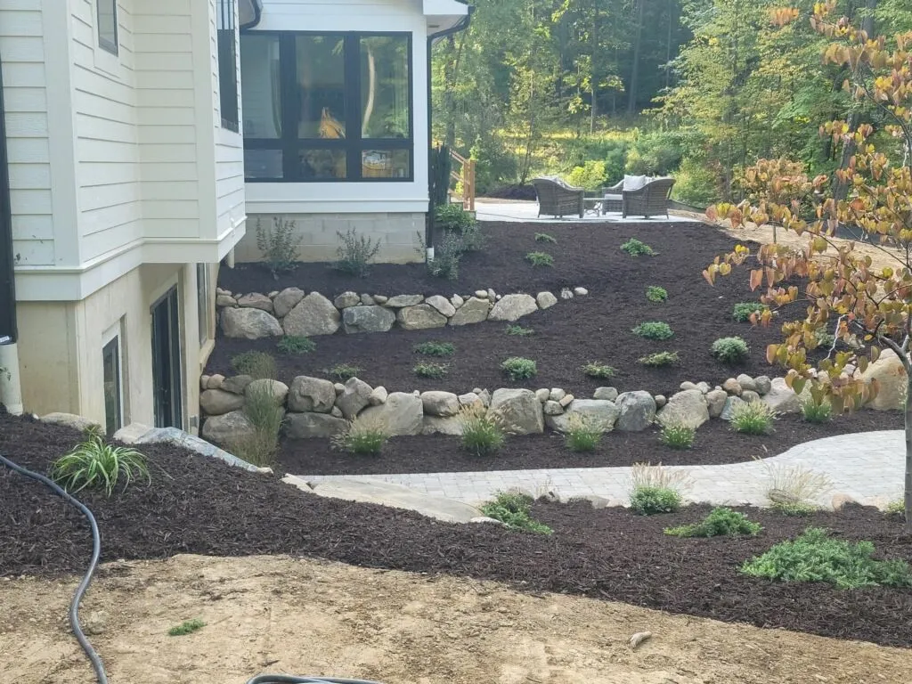 Well-maintained residential landscaping with stone edging